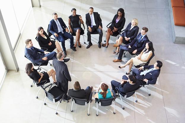 employees sitting around in a circle
