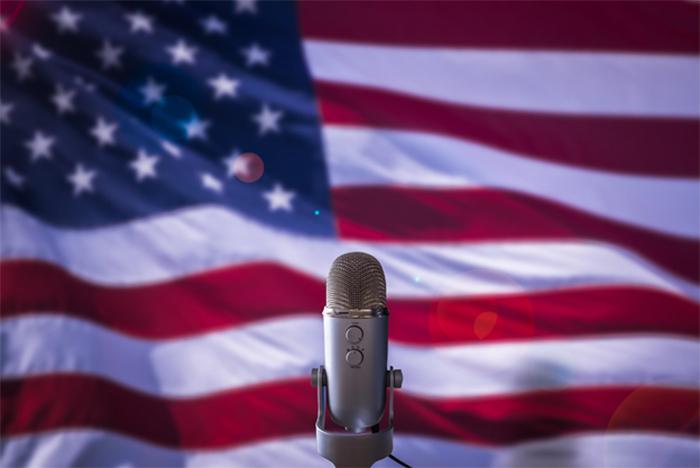 microphone in front of an american flag