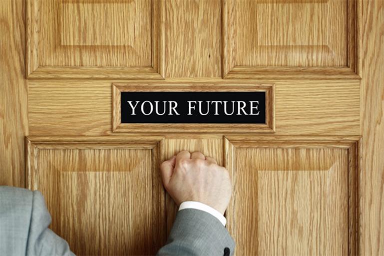 close-up of fist knocking on door that says your future